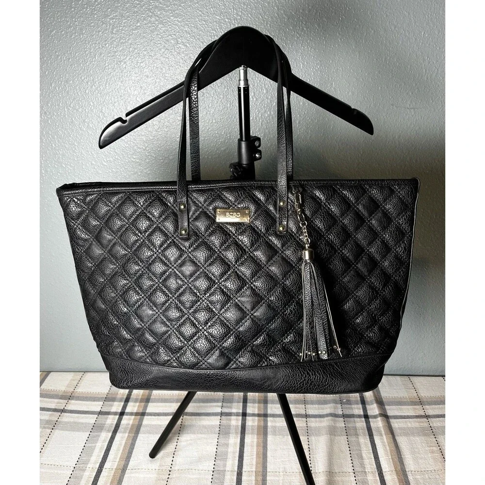 BCBG Women's Black Quilted Faux Leather Tote Bag with Tassel Accent